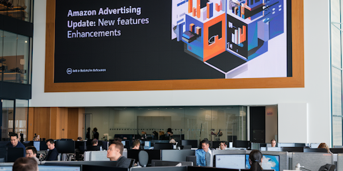 modern office space with several Amazon employees working at desks